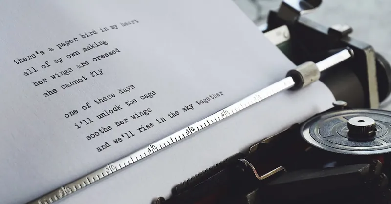 Close-up of a vintage typewriter printing a heartfelt poem on paper.