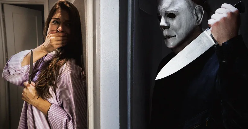 Dramatic horror scene featuring a masked figure and frightened woman indoors.
