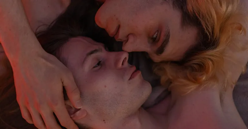 A soft, intimate portrait of a couple in a warm embrace, highlighting love and connection.
