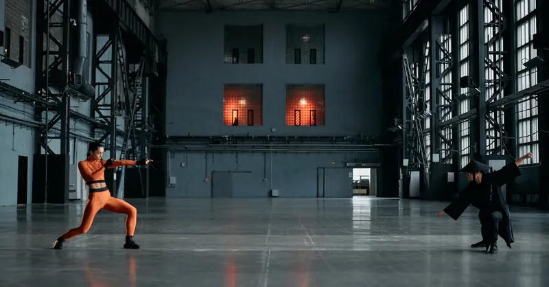 Action-packed martial arts duel in an industrial warehouse with dramatic lighting.